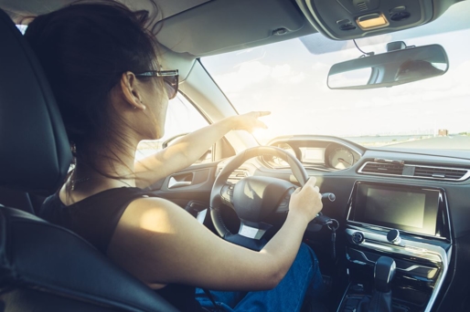 a woman driving a car
