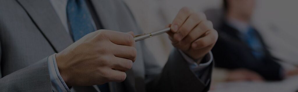 a person holding a pen