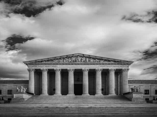 a building with columns and steps

