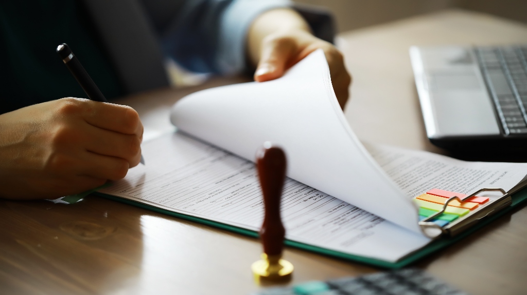 Man is working with documents