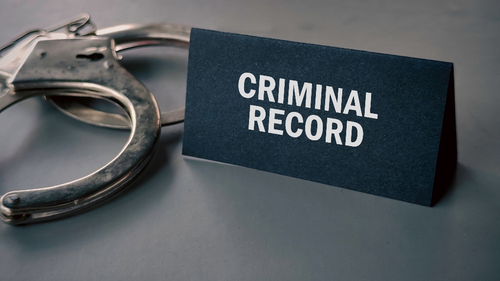 Criminal Record and handcuffs